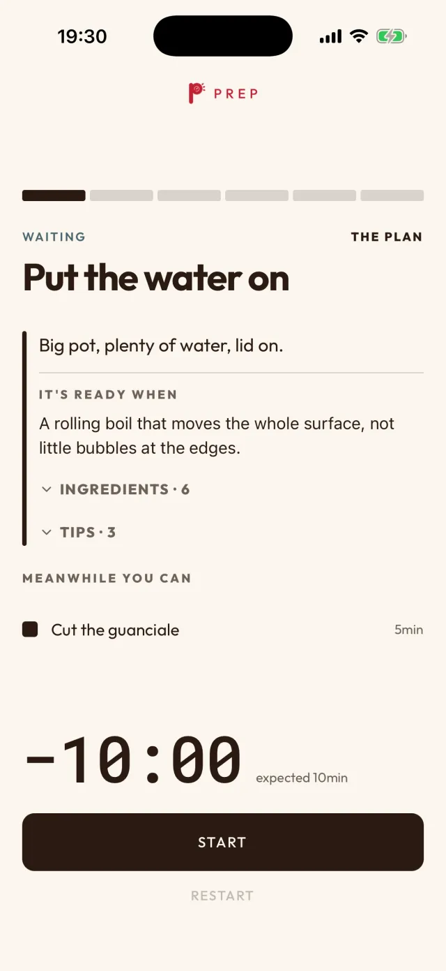 Cooking in the app, first step: put the water on, a wait; it’s ready at a rolling boil that moves the whole surface, and meanwhile you can cut the guanciale, 5 minutes. The timer reads minus 10 minutes.